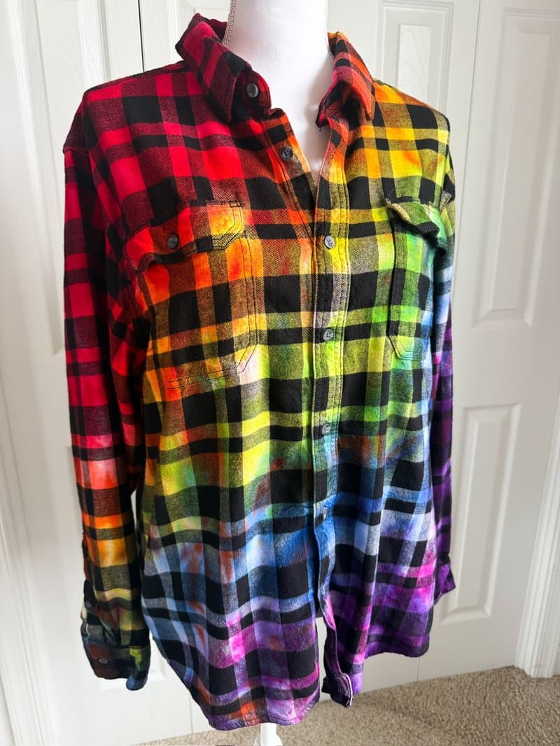 Rainbow plaid flannel displayed on white mannequin