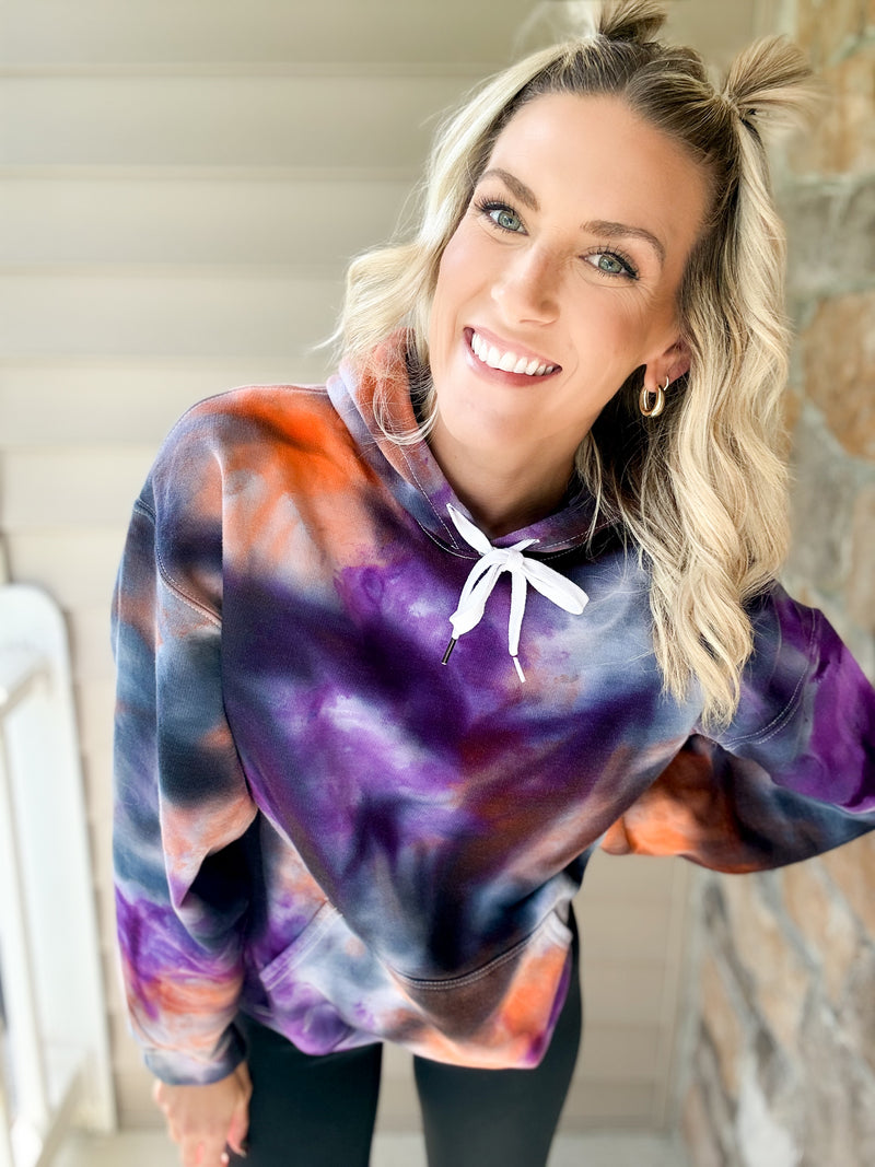 Maria laughing in the Halloweentown ice-dye hoodie, hand dyed purple, orange and black
