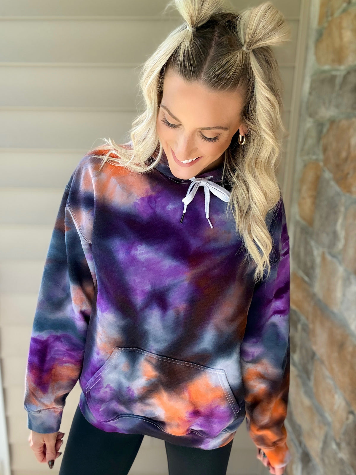Full-length view of the Halloweentown ice-dye hoodie showing the purple, orange and black pattern