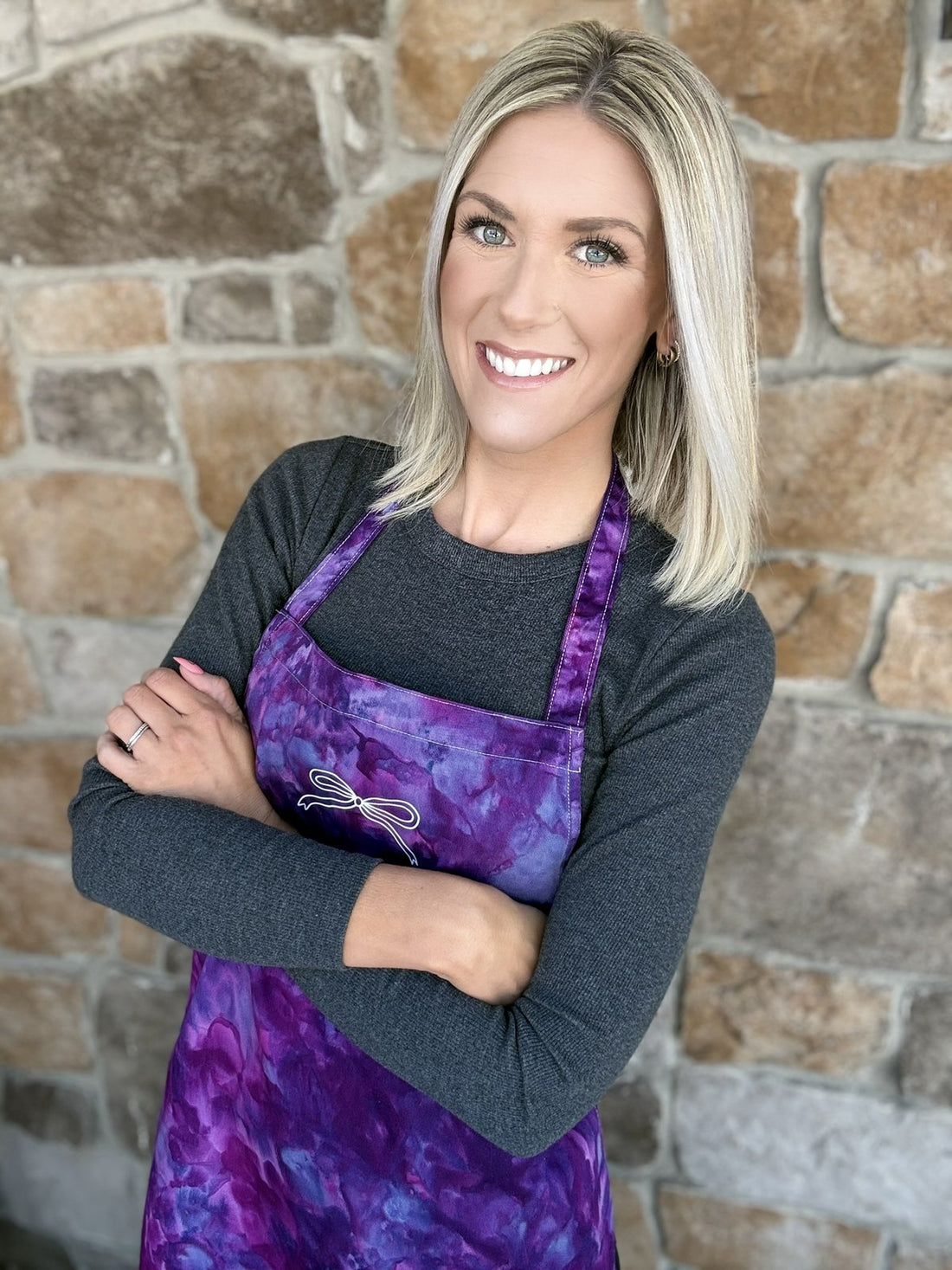 Maria in the studio, wearing an apron she dyed herself